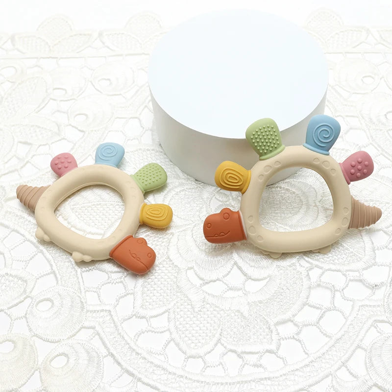 Mordedor Sensorial em Silicone – Forma de Dinossauro